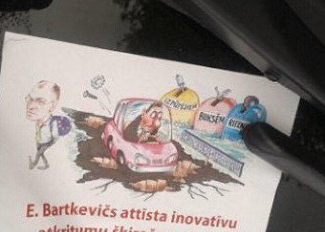 Ogrē priekšvēlēšanu karstumā automašīnas aplīmē ar karikatūrām