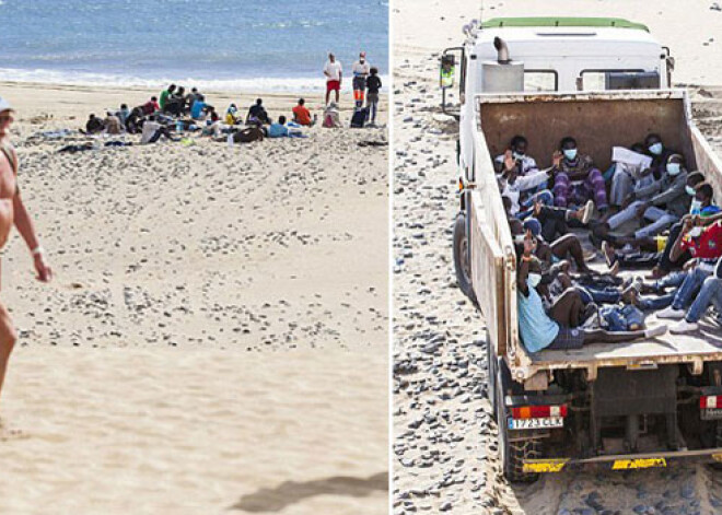 Kanāriju salu nūdistu pludmalē Ebolas paniku izraisa nelegālo imigrantu laiva. FOTO