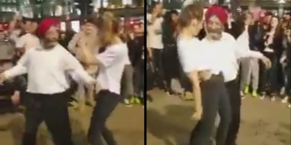 Pakistānis Londonas ielās laižas jautrā dejā ar vietējo blondīni. VIDEO