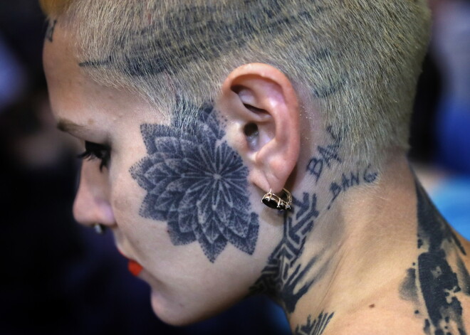 MOSCOW, RUSSIA - APRIL 1, 2017: A participant in the 2017 Moscow Tattoo Festival at Moscow's Amber Plaza Shopping Center. Tattoo artists from all over the world take part in the event. The festival's program includes a tattoo contest, body taping art marathon, masterclasses, round table discussions and conferences. Valery Sharifulin/TASS