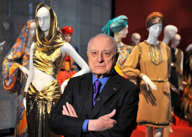 FILE PHOTO: French businessman Pierre Berge poses among creations of late French fashion designer Yves Saint-Laurent to promote the exhibition Yves Saint Laurent at the Petit Palais in Paris, March 8, 2010.   REUTERS/Philippe Wojazer/File Photo