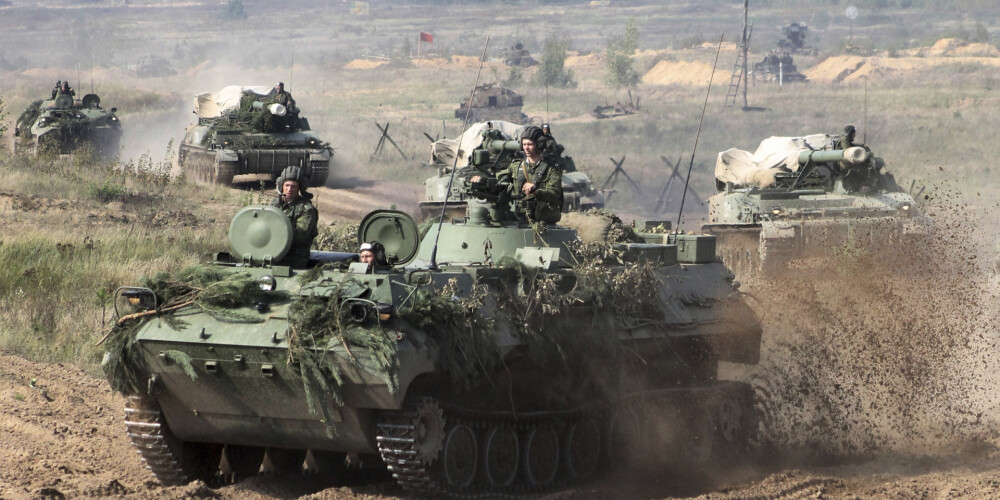 In this photo taken on Monday, Sept. 11, 2017, Belarusian army vehicles drive preparing for war games at an undisclosed location in Belarus. Russia and Belarus are holding a massive war games, Zapad 2017, that due to start on Thursday near the borders of Poland, Estonia, Latvia and Lithuania. (Vayar Military Agency photo via AP)