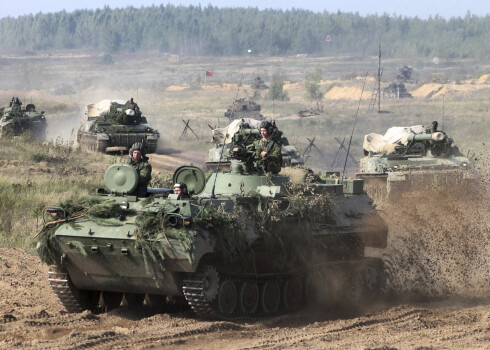 In this photo taken on Monday, Sept. 11, 2017, Belarusian army vehicles drive preparing for war games at an undisclosed location in Belarus. Russia and Belarus are holding a massive war games, Zapad 2017, that due to start on Thursday near the borders of Poland, Estonia, Latvia and Lithuania. (Vayar Military Agency photo via AP)