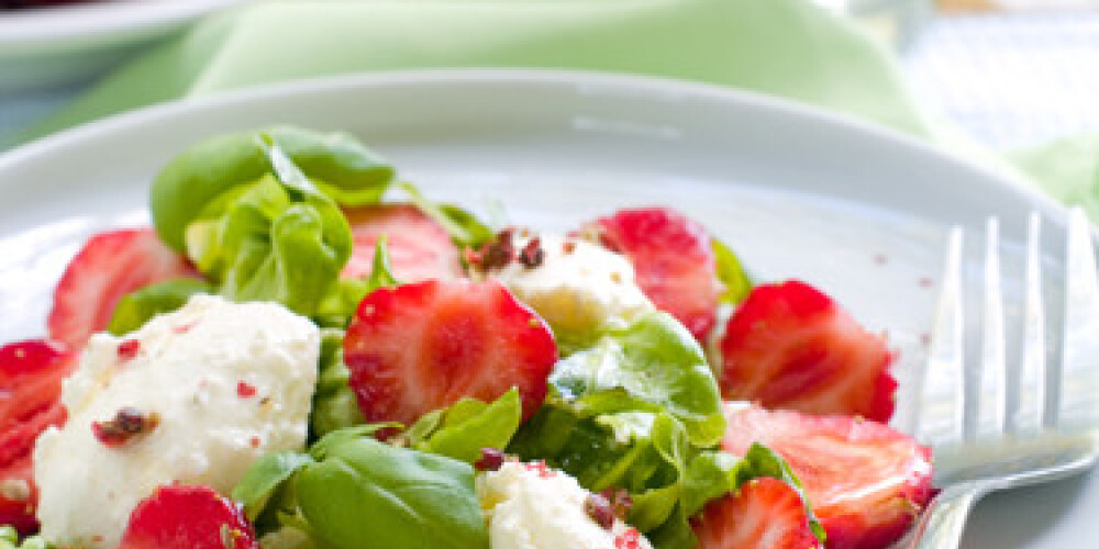 Fresh salad with mascarpone and strawberry. Selective focus