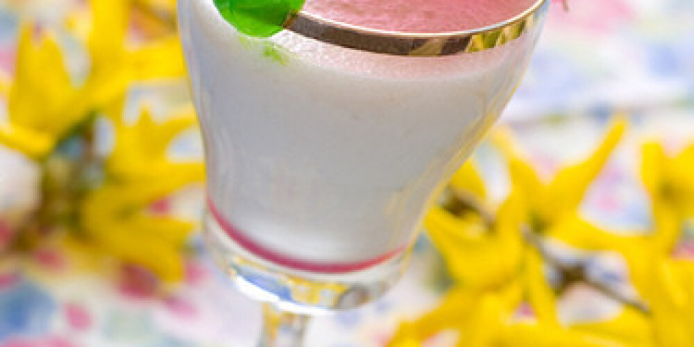 Vanilla milkshake with cherry garnish  with shallow depth of field.