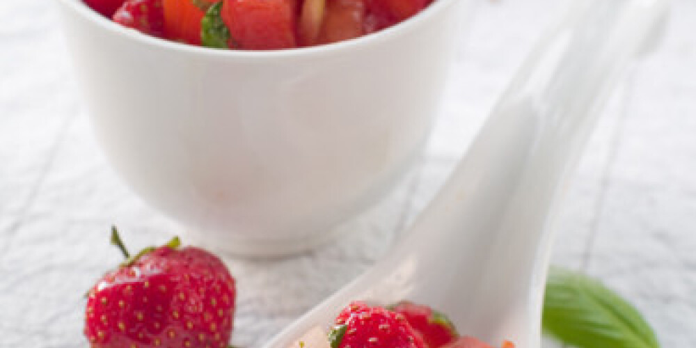 Tomato and strawberry salsa in bowl. Selective focus