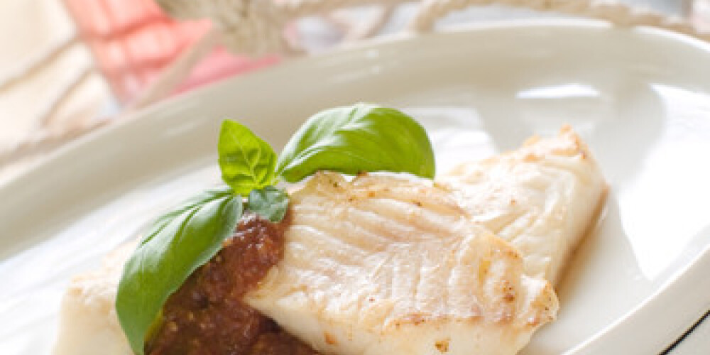 Fish fillet with sauce and basil for your healthy dinner
