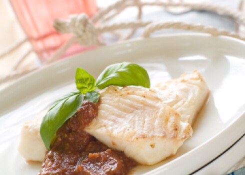 Fish fillet with sauce and basil for your healthy dinner