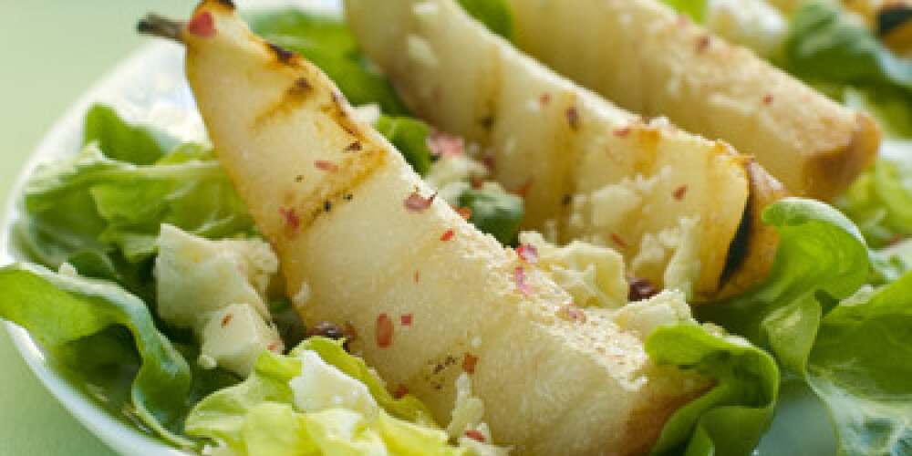 Fresh salad with pear and goat cheese. Selective focus