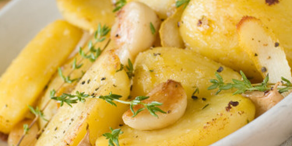 Roasted potatoes with garlic and thyme, selective focus