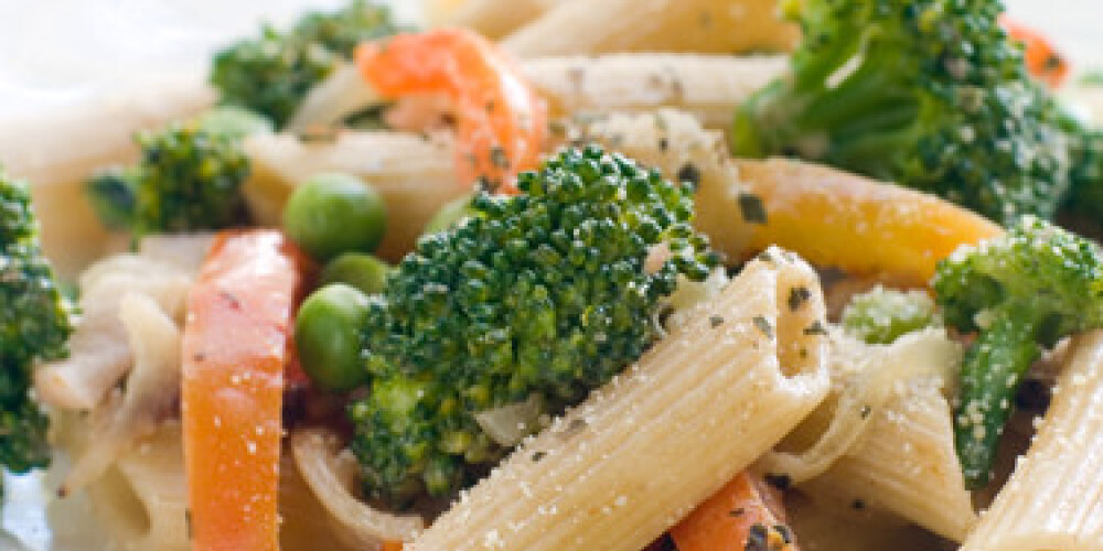 Fresh pasta with broccoli, pepper and peas. Selective focus