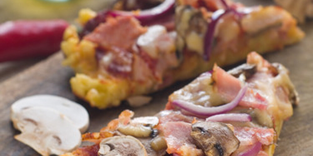 Pizza with mushrooms, bacon and onion, selective focus