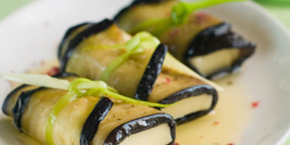 Marinated eggplant roll with cheese, selective focus