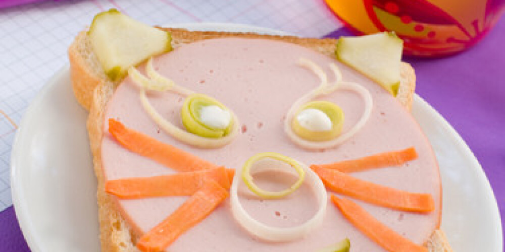 breakfast with sandwich for child with drink on background. Selective focus