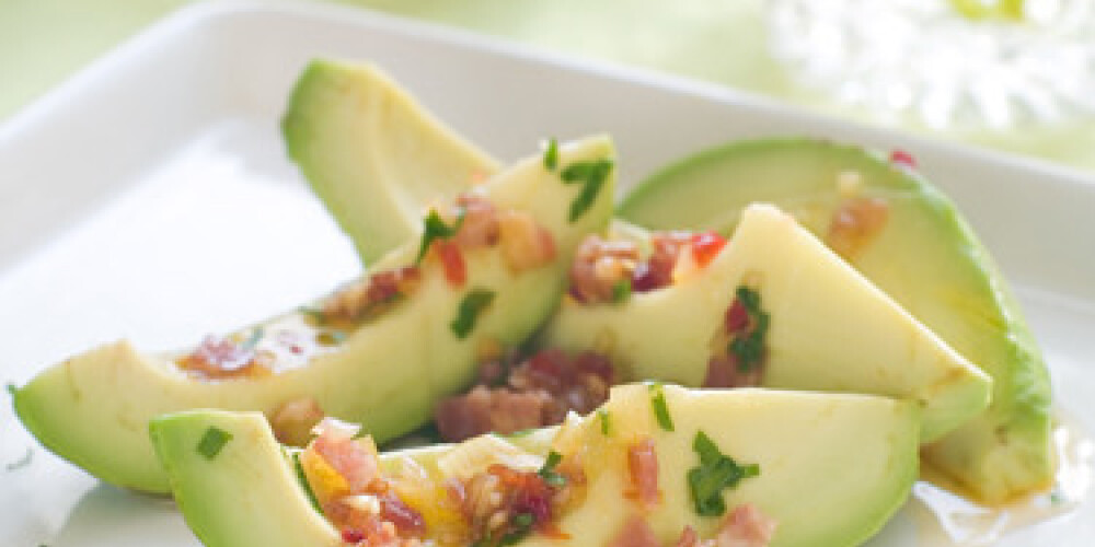 Avocado appetizer with parsley and vinaigrette, selective focus