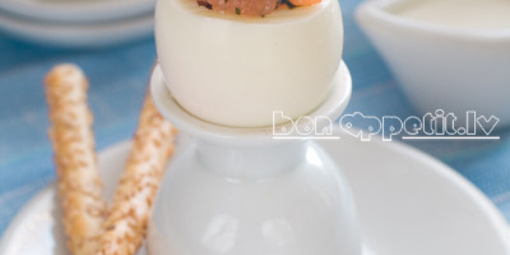 Egg with salmon and black caviar, selective focus