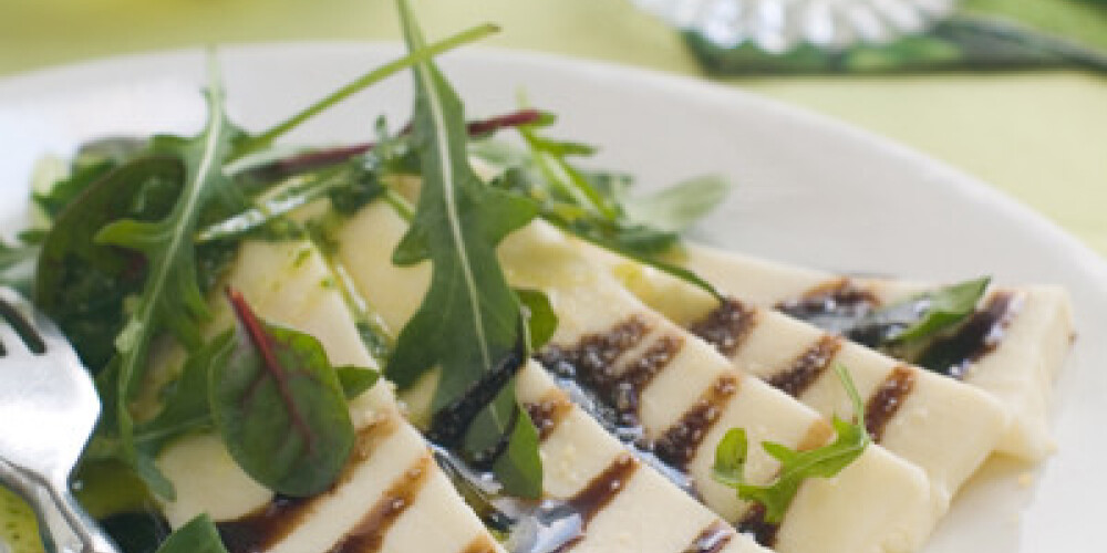 Cheese and arugula appetizer, selective focus