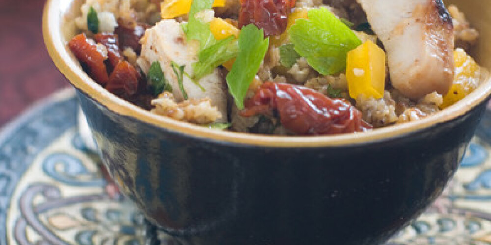 Couscous salad with dried tomato, pepper and parsley, selective focus