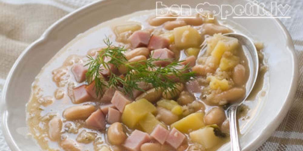 Vegetable soup with beans and ham, selective focus