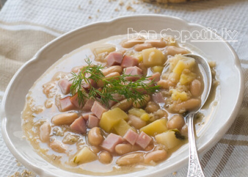 Vegetable soup with beans and ham, selective focus