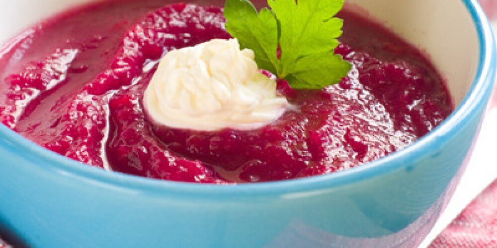 Beet cream soup with garlic and sour cream, selective focus