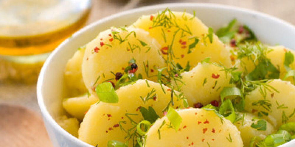 Potato salad with parsley, dill and olive oil. Selective focus