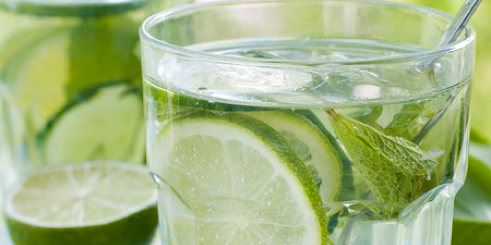 cold fresh lemonade drink with mint and lime close up. Selective focus