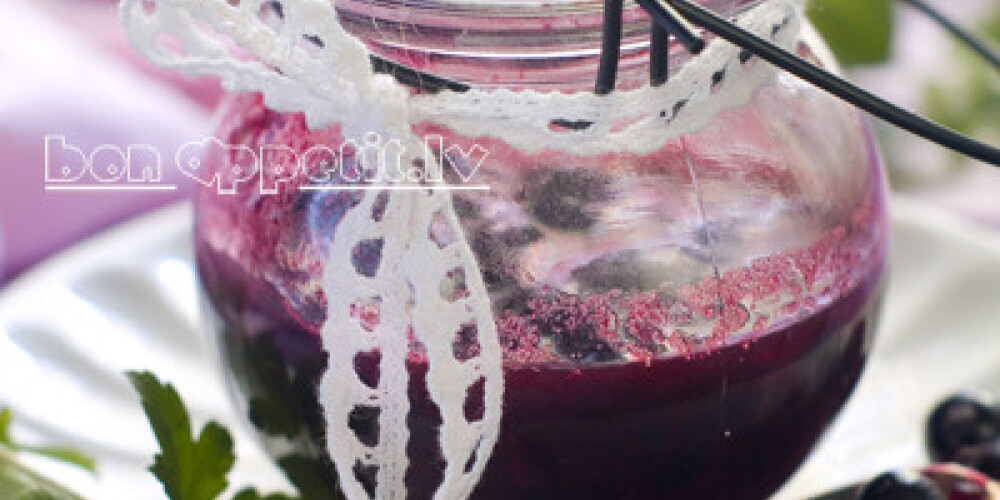 Black currant jam in glass jam-jar. Selective focus