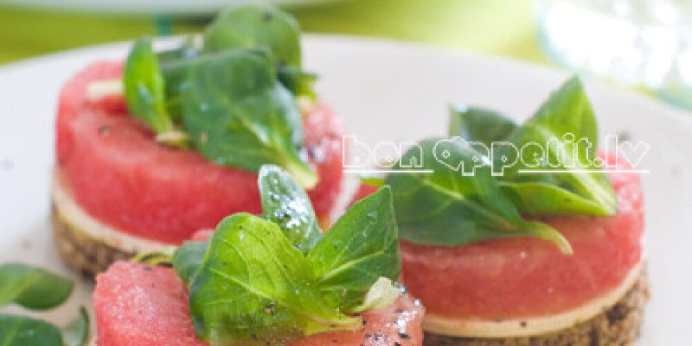 Watermelon appetizer with bread and cheese, selective focus