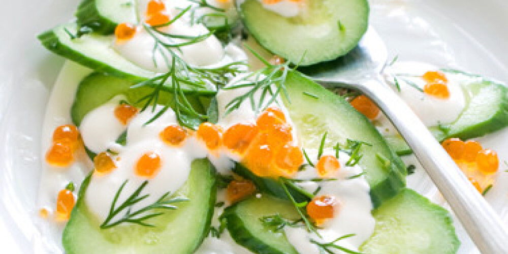 Appetizer from cucumber, caviar and sour cream