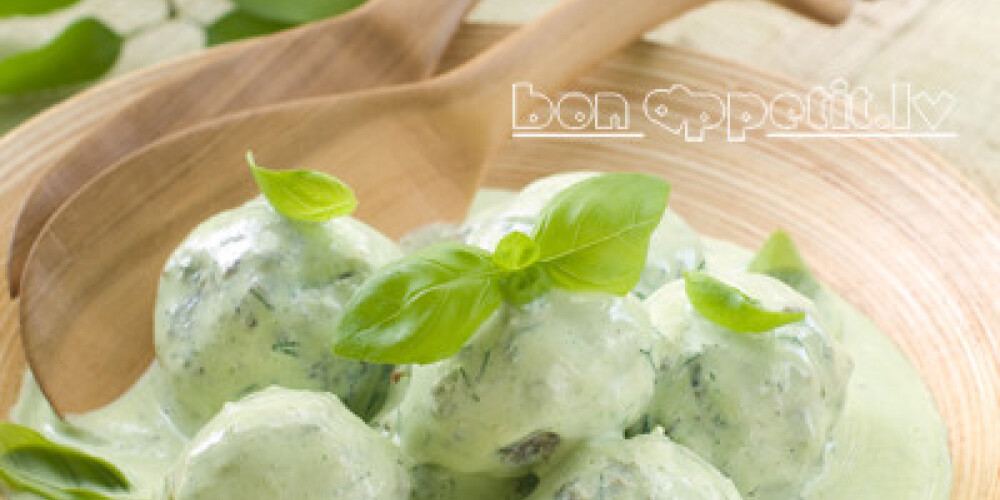 Beef meatballs in green sauce, selective focus