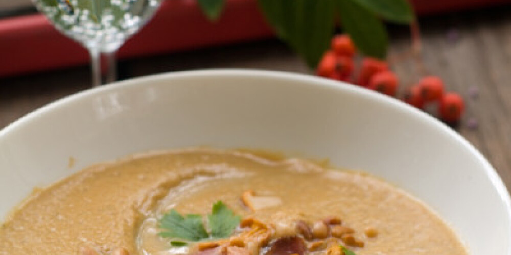 Mushroom soup with chanterelle, fiber nuts and bacon, selective focus