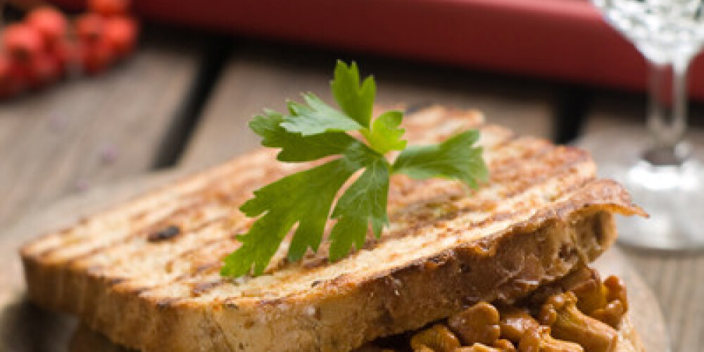 Sandwich with mushrooms, cheese and bacon, selective focus