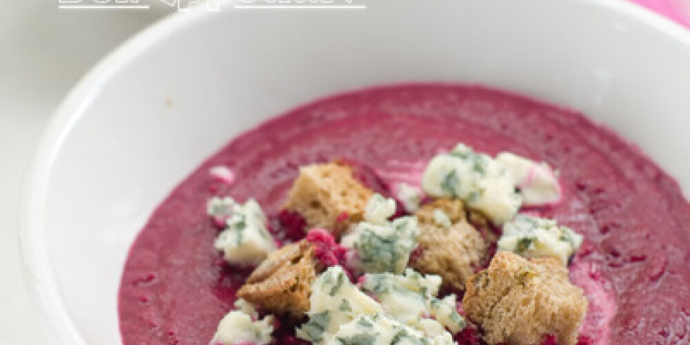 Beet cream soup with roquefort and croutons, selective focus