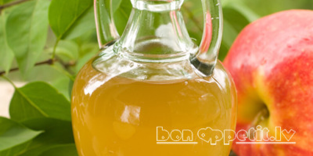 Apple cider vinegar in glass bottle, selective focus