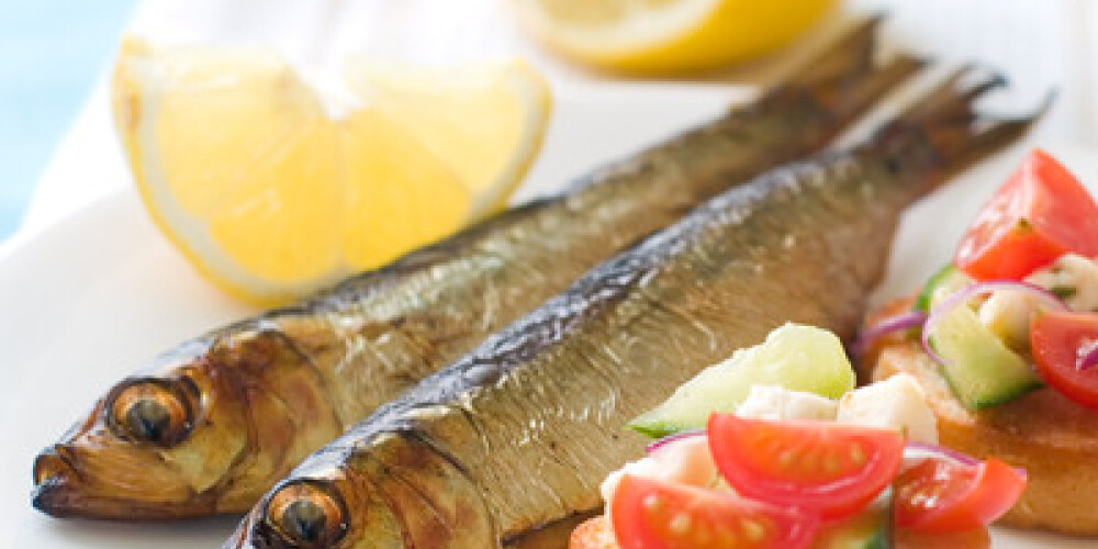 Smoked fish with bruschetta, selective focus