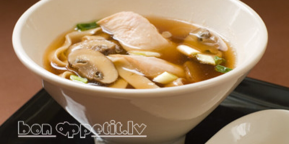 Asian noodle soup with chicken and mushrooms, selective focus