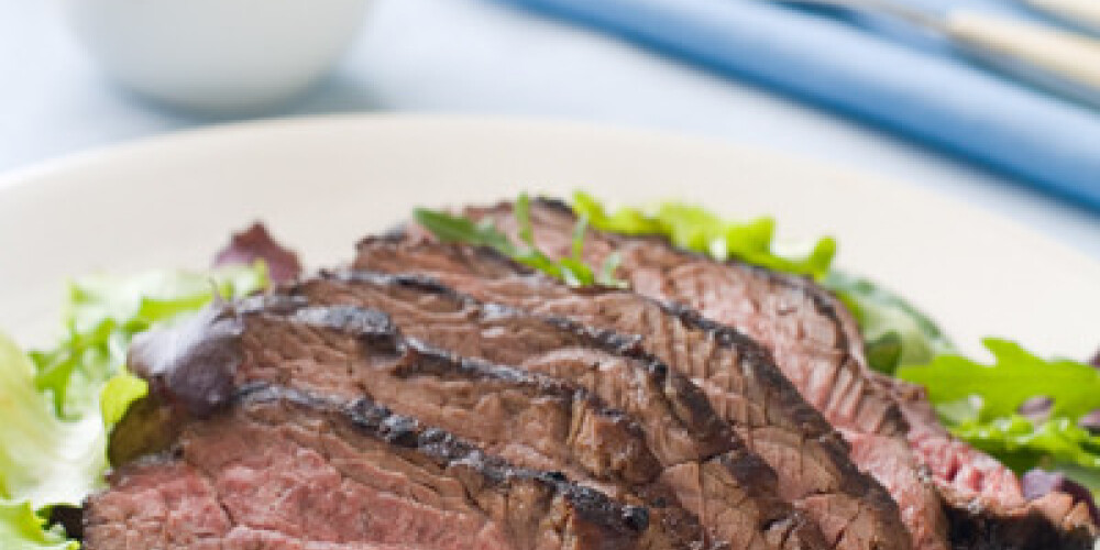 Ostrich steak with fresh salad, selective focus