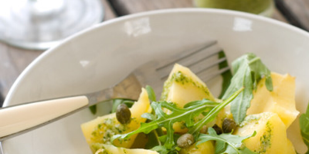 Potato salad with pesto and arugula, selective focus