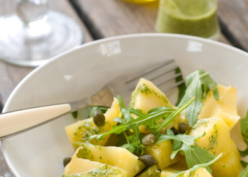 Potato salad with pesto and arugula, selective focus