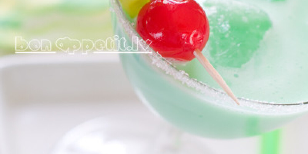 Green cocktail with ice, selective focus