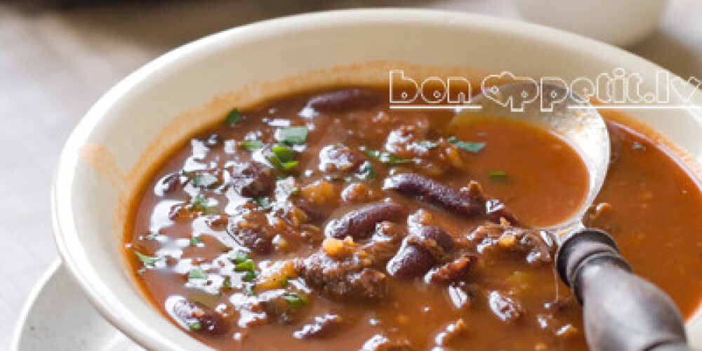 A bowl of homemade chili bean soup with meat, selective focus