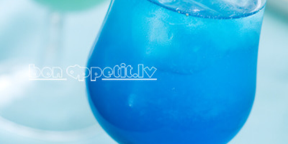 Blue cocktail with ice, selective focus