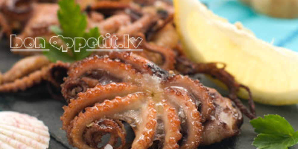 Grilled octopus with lemon, selective focus