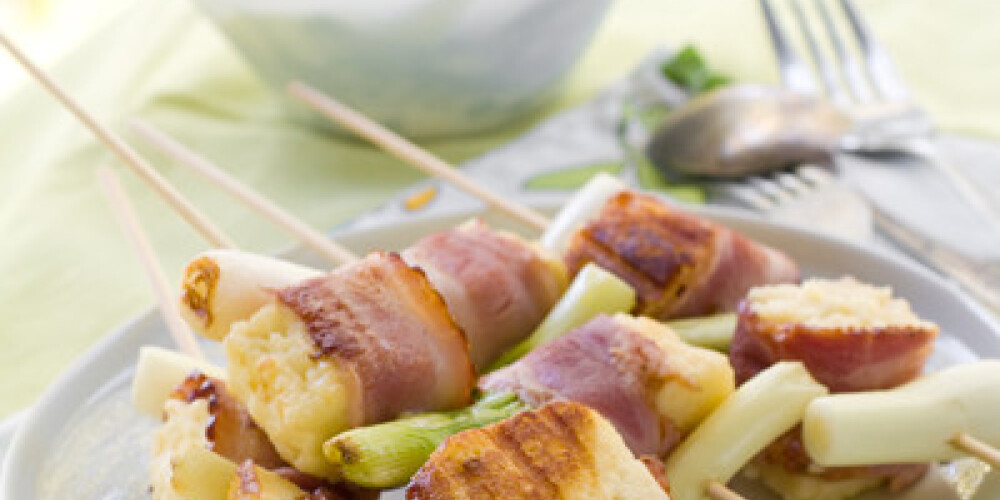 Grilled cheese kebab with spring onion, selective focus