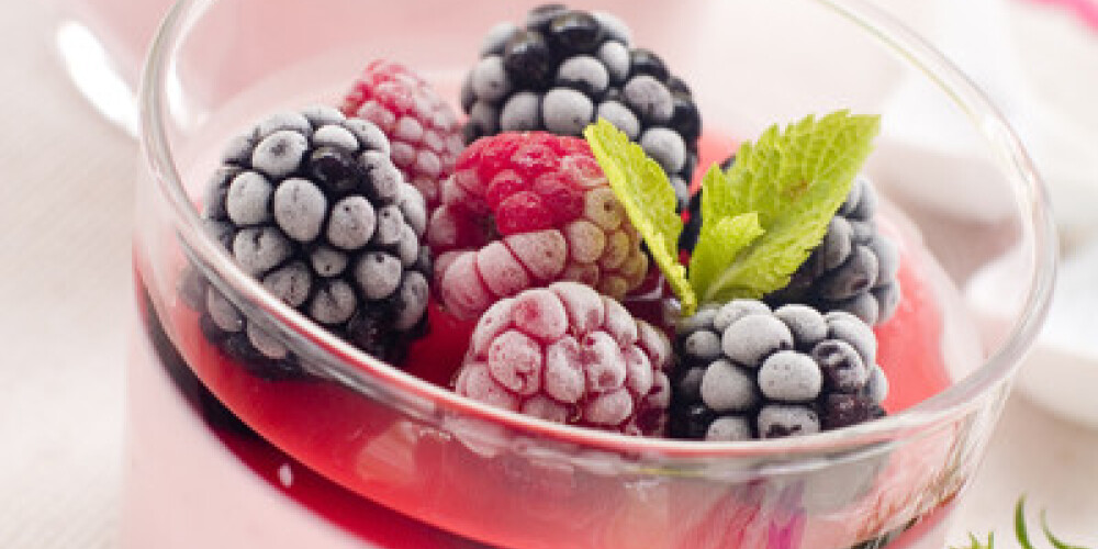 Milk dessert with raspberry and blackberry. Selective focus