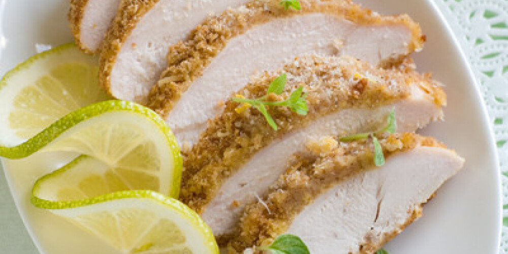 Chicken crumbed breast with lemon, selective focus