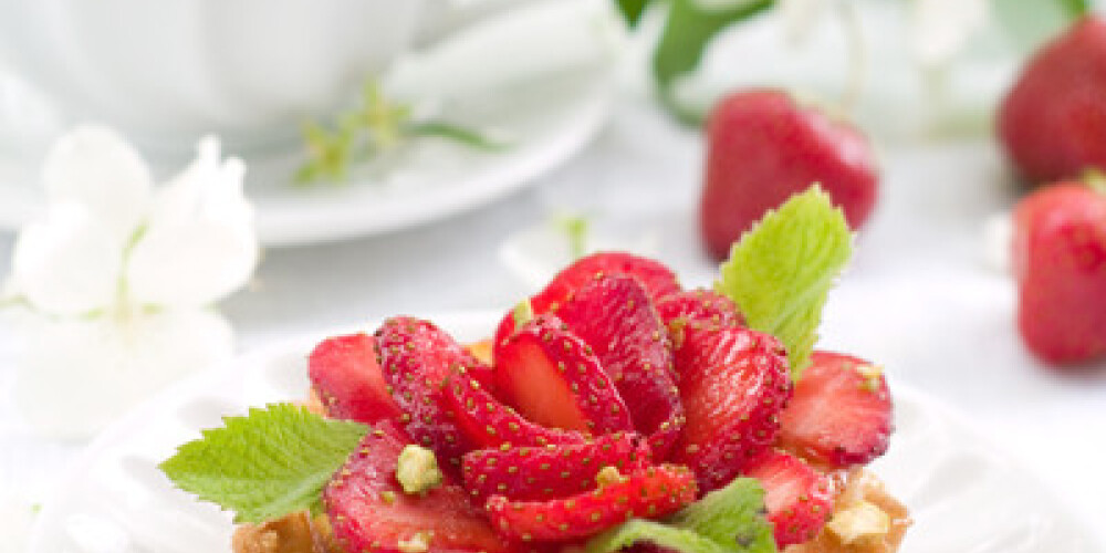 A fresh strawberry tart on a plate, selective focus