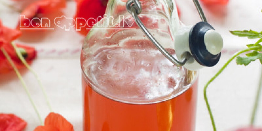 Fresh lemonade drink with poppy on background, selective focus