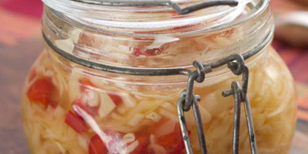 Marinated cabbage (sauerkraut) in glass jar, selective focus